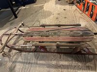 Top view of Royal Racer wooden sled showing slatted deck and runners