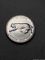 Reverse of coin showing bobcat design and date