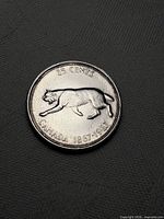 Reverse showing bobcat design and inscriptions