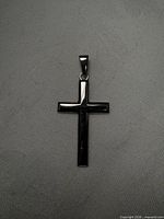 Front view of sterling silver cross pendant