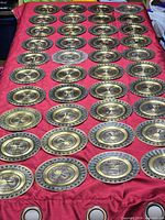 Full group of 40 plates arranged on cloth