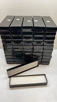 Stack of black gloss jewelry boxes showing total quantity