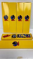 Five yellow boxed Dick Tracy watch sets, one box open
