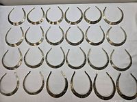 Grid layout showing quantity and uniform style of torc chokers