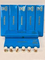 Group shot of six thimbles with eight blue Keepsakes boxes