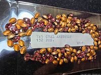 Full spread of beads with manufacturer label showing size and quantity