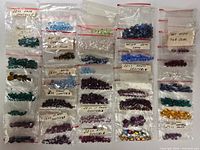 All bags of rhinestones laid out in rows