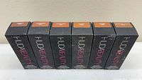 Six Huda Beauty foundation boxes front view