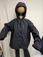 Front view of black hooded Dickies jacket on mannequin
