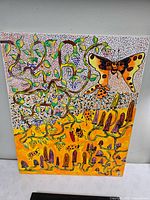 Full view of colorful mixed-media canvas