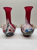 Front view of both art glass bud vases showing colour pattern and applied accents