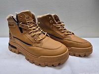 Lateral view of both boots showing overall design, color and sole