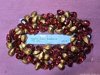 Rhinestones on label showing size, colour and quantity