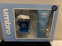 Front view of boxed gift set showing both eau de toilette bottle and shower gel tube