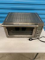 Front and top view of the Breville stainless steel toaster oven showing overall form and surface wear