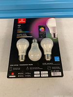 Front of retail package showing three bulbs and product specifications