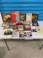 Full lot overview showing books and card sets on table