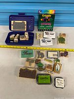 Overview of mixed stamps, inkpads, marker pack and storage case