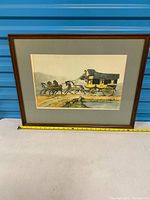 Full view of framed etching with measuring tape for scale