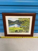 Front view of framed watercolor landscape painting