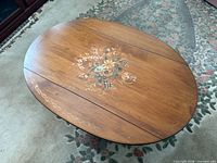 Top view showing oval shape, floral decoration and leaf seams