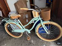 Full view of the Huffy Nel Lusso cruiser bicycle showing frame, basket, rack and accessories