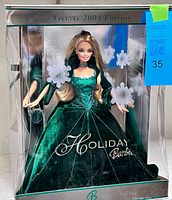 Front view of boxed 2004 Holiday Barbie showing full doll and packaging graphics