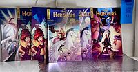 Front view of all six Hercules variant comics standing upright