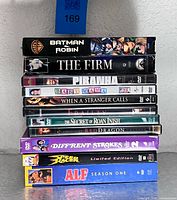 Stack of eleven DVD cases showing all title spines