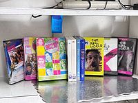 Front view of all ten cases lined on shelf