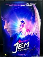 Full view of Jem and the Holograms poster showing artwork and signature