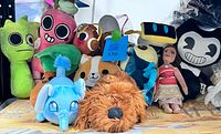 Group shot showing full assortment of plush toys on tabletop