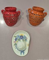 Front view of all three ceramic wall pockets