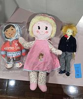 Group shot of all three dolls showing relative sizes and attire