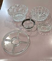Five glass pieces laid out showing overall lot contents