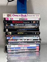 Stack of all 14 DVD cases showing titles on spines