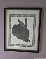 Full view of framed rabbit sketch on wall