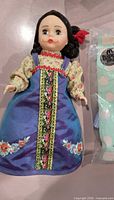 Full view of Russian Kukla doll in traditional dress