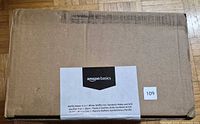 Sealed cardboard box with Amazon Basics label