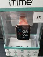 Front of boxed iTime smartwatch showing watch face and band