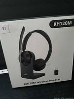 Front of retail box showing headset, dock, USB receiver and model number KH120M