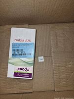 Front of Nubia A75 retail box inside shipping carton
