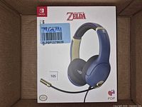 Front of sealed headset box showing Legend of Zelda branding and headset image
