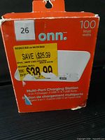 Front of damaged Onn packaging showing 100 W rating and product name