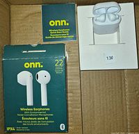 Retail box front showing onn. wireless earphones features