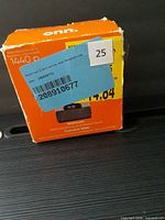 Front of ONN webcam box showing brand, 1440p spec and damaged corner