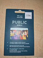Front of sealed Public Mobile SIM card package showing branding and key features