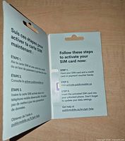 Inside of package displaying bilingual activation steps and SIM card
