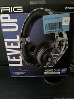 Front of retail box showing RIG 400HS CAMO headset image and branding