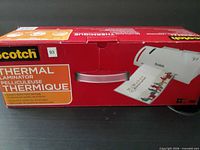 Front view of sealed Scotch Thermal Laminator box
